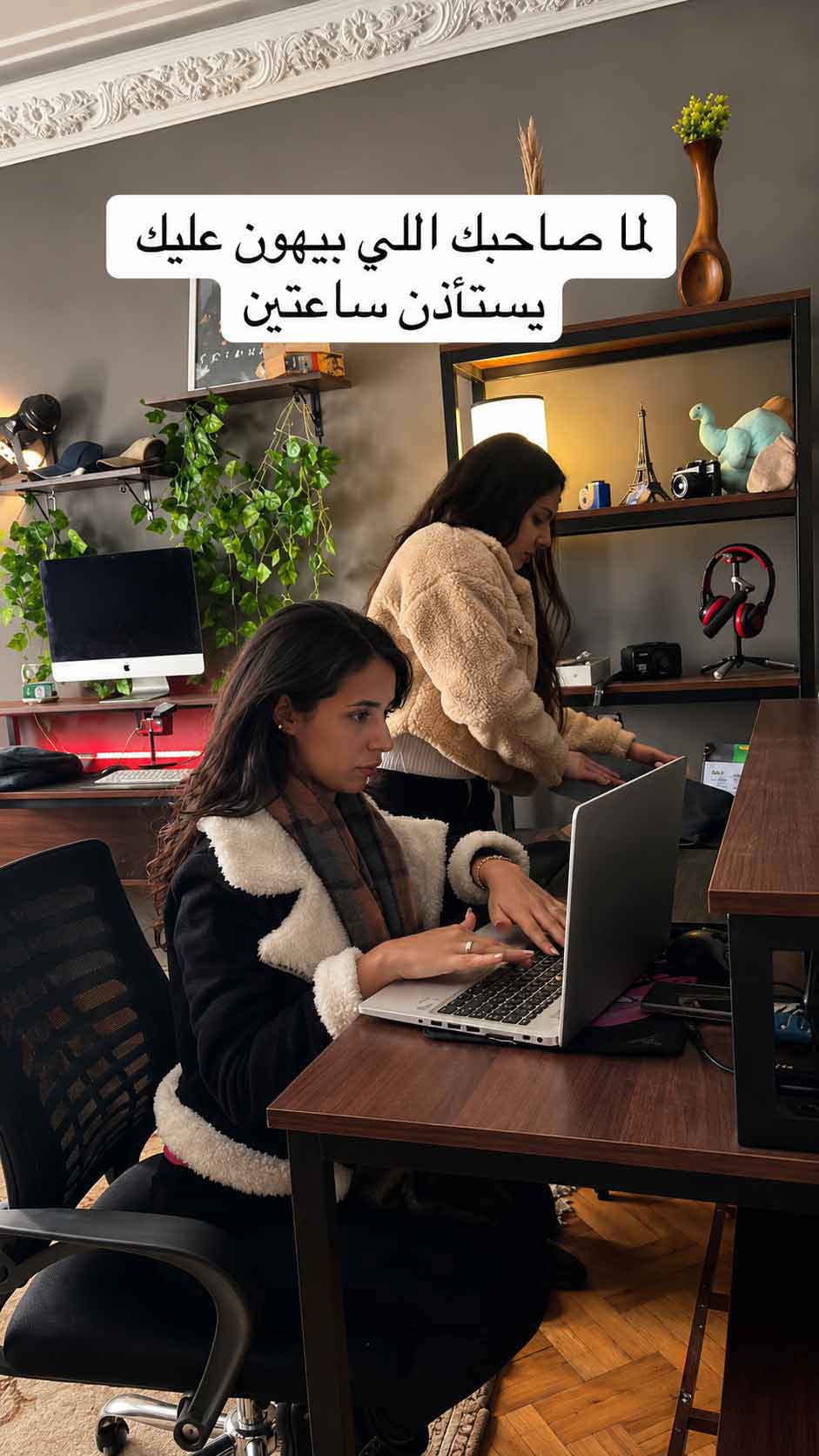 Optiiimum teammates focused at their desks during a work session